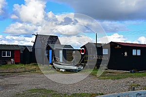 Boat and Fishermens Huts in Southwold Harbour, Suffolk, UK