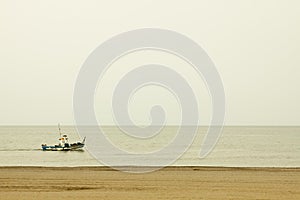 Boat fishing in the sea near the beach