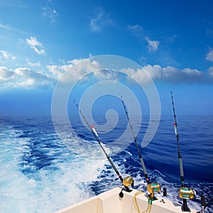 Boat fishing trolling in deep blue ocean offshore