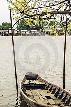 Boat, fishing village and willow tree flowers in Myanmar 1