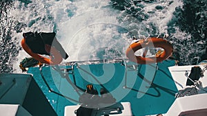 Boat is Floating on the Waves and Leaves a Trail in the Red Sea. Slow Motion