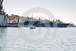 Boat in front of harbor.