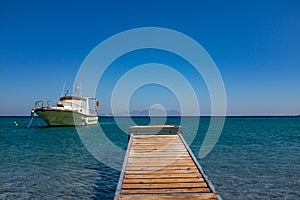 A boat in front of a jetty