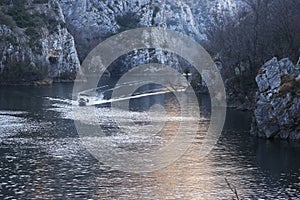 Boat goes by the river in Matka Canyon