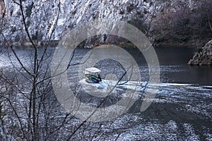 Boat goes by the river in Matka Canyon