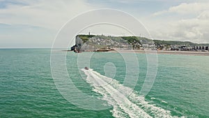 The boat goes to the port of Etretat, located between the sheer cliffs