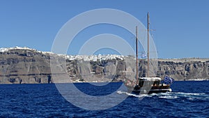 Boat heading towards the town of Fira in Santorini