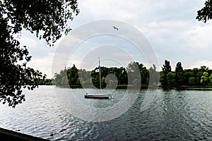 Boat on the Herastrau lake in a summer day