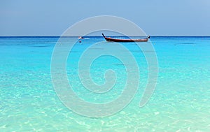 A boat on the horizon in the beautiful turquoise waters of the Similan islands, Koh, Similan, Phang Nga Province, Thailand