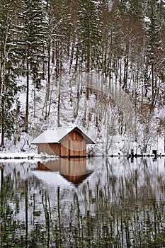 Boat house at Almsee on a winter day, vertical