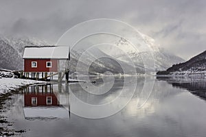 Boat house reflection in the Norwegian fjords