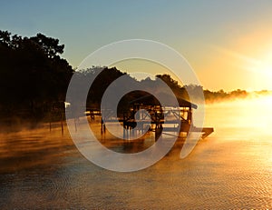 Boat House surrounded by Golden Fog