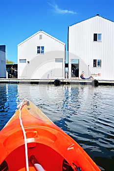 Boat house in Tacoma, WA and orange kayak