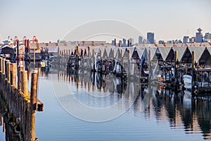 Boat `houses` or `garages` line the docks at Mosquito Creek