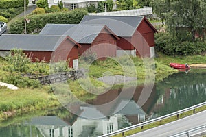 Boat houses on a stream Olden Norway.