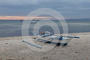 Boat on idyllic beach on island in Phillipines