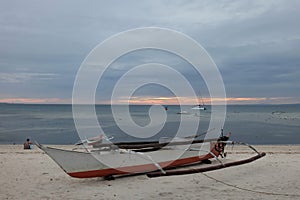 Boat on idyllic beach on island in Phillipines