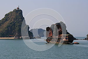 boat and islets in the the ha long bay - vietnam
