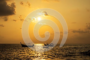 Boat at Kalim Beach at twilight time sky in summer Phuket