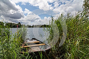 Boat on a lake with blue sky in summer