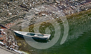 Boat on the lake - boat at shore - water reflection