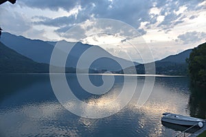 Boat on Lake Mergozzo in the early evening sun after a thunderstorm