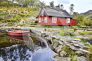 boat and lake, red wooden house, Norway