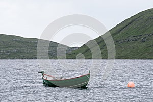 Boat on Lake Sorvagsvatn or Leitisvatn on Vagar Island, Faroe Islands