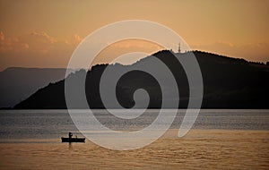 Boat on lake during sunset