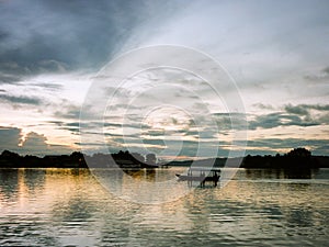 Boat on lake at sunset in Guatemala