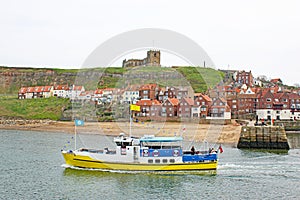 Boat leaving Whitby Harbour, Yorkshire