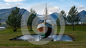 Boat levitating on a small lake.