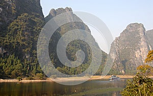 A boat on the Li River between Guilin and Yangshuo in Guangxi Province, China