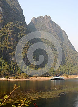 A boat on the Li River between Guilin and Yangshuo in Guangxi Province, China