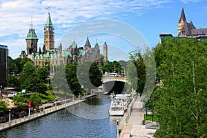 Boat lined Rideau Canal towards Parliament Hill, Ottawa, Ontario, Canada