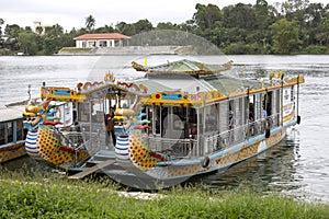 Boat that makes excursions to tourists decorated with dragons in the Perfume river of Hue, Vietnam photo