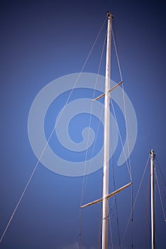 Boat mast on blue sky