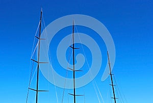 Boat mast under blue sky