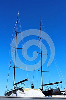 Boat mast under blue sky
