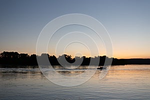 Boat on mississippi river during sunset in la crosse wisconsin