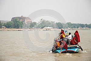 Boat with monks and the Mingun pagoda