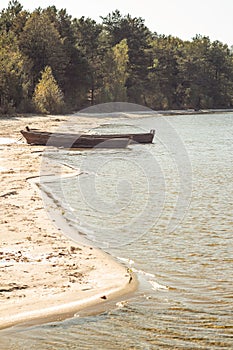 Boat moored on the lake shore