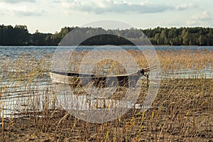 Boat moored on the mudy shore lake