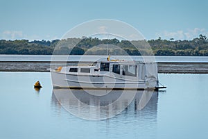 Boat moored in Pumicestone Passage, near Brisbane, Queensland, Australia