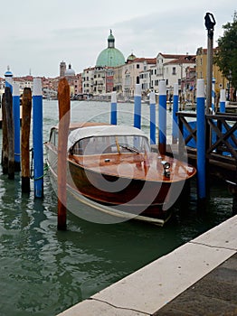 Boat moored and typical buildings on the Grand Canal Venice Italy