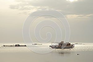 Boat during the morning time of Asker beach Bahrain photo