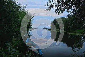 A boat in the mouth of the river Trubezh in Pereslavl-Zalessky, Russia