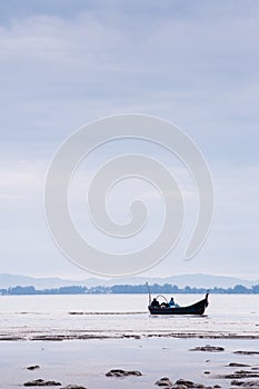 Boat near beach on low tide