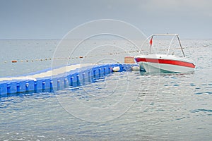 Boat near blue pontoon bridge