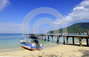 A boat with a blue sky landscape in perhentian island photo